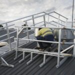 Defender™ walkway leveled for steep roofs provide a safe platform for technicians.